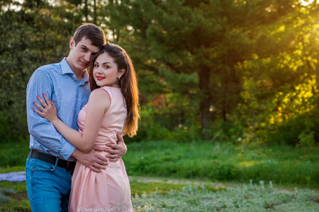 Portrait of young love couple walking in the forestの写真素材