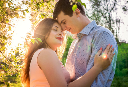 Portrait of young love couple in the forestの写真素材