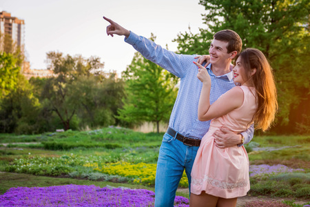 Portrait of young love couple walking in the forestの写真素材