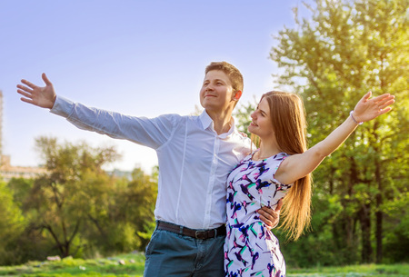 Portrait of young love couple in spring gardenの写真素材