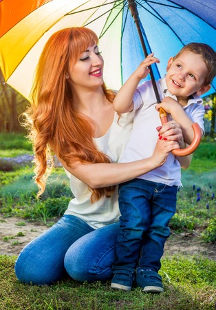Young mother playing with her little son in spring garden. Mother's Day conceptの写真素材