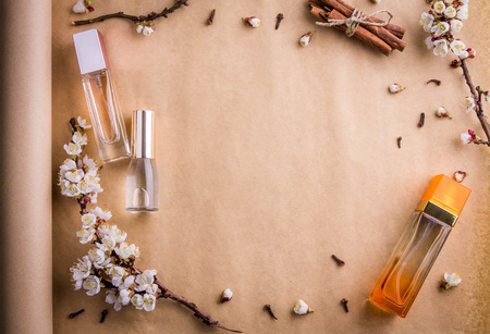 Bottles of perfume with ingredients on paperの写真素材