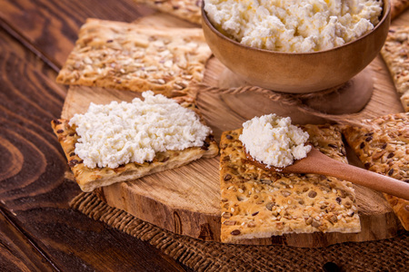 Healthy biscuits with grains and seeds on wooden tableの写真素材