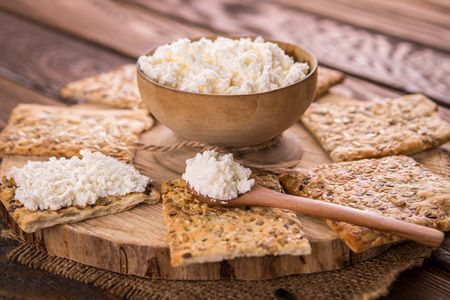 Healthy biscuits with grains and seeds on wooden tableの写真素材