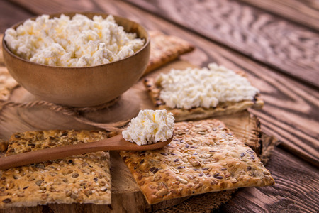 Healthy biscuits with grains and seeds on wooden tableの写真素材