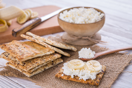 Healthy biscuits with grains and seeds on wooden tableの写真素材