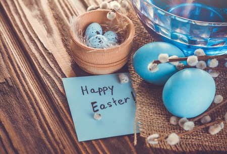 Easter background with eggs on wooden tableの写真素材
