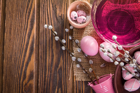 Easter background with eggs on wooden tableの写真素材