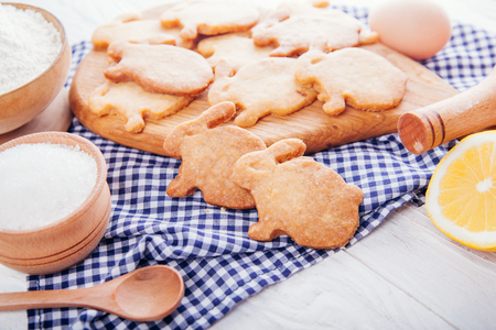 Easter symbol concept. Biscuits with ingredients. Baking Easter cookies bunny-shaped. Home-made food.の写真素材