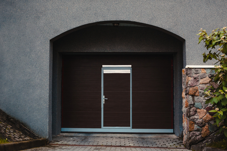 Wooden garage door. Modern garage in new building. Closed shed doorの写真素材