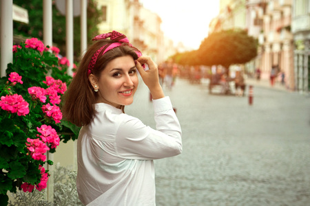 Young beautiful woman walking in old city centerの写真素材