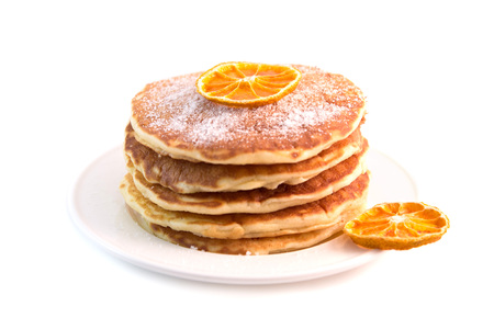 Stack of pancakes with sugar powder isolated on white background. Tasty dessertの写真素材