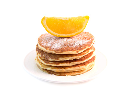 Stack of pancakes with sugar powder isolated on white background. Tasty dessertの写真素材