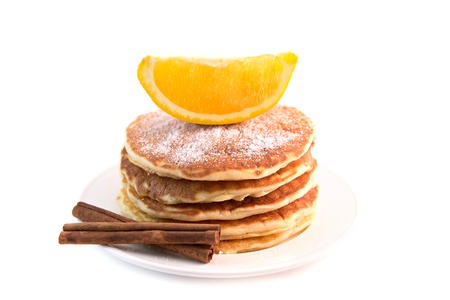 Stack of pancakes with sugar powder isolated on white background. Tasty dessertの写真素材