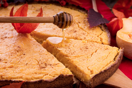 Pumpkin pie with honey, berries and cinnamon. Healthy food. Fall dessertの写真素材
