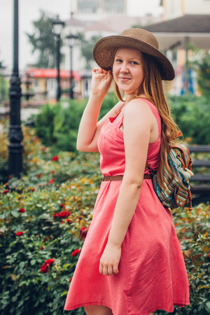 Teenager traveler girl walks in the city centerの写真素材