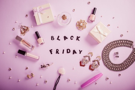 Set of accessories and cosmetics on purple background available for sale on Black Fridayの写真素材
