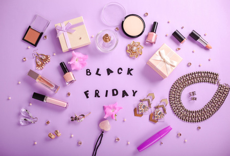Set of accessories and cosmetics on purple background available for sale on Black Fridayの写真素材