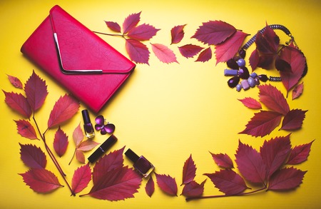 Set of cosmetics and accessories on yellow autumn backgroundの写真素材