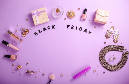 Set of accessories and cosmetics on purple background available for sale on Black Fridayの写真素材