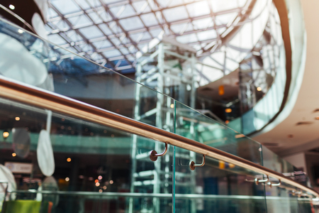 Modern buildings. Shopping center interior design details. High tech architecture. Close-up of handrail. Roof and elevator. Glass ceilingの写真素材