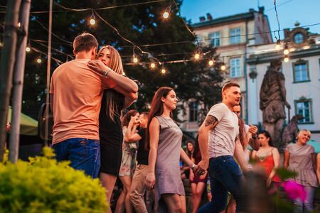 Lviv, Ukraine - August 4, 2018. People dancing salsa and bachata in outdoor cafe in Lvivのeditorial素材
