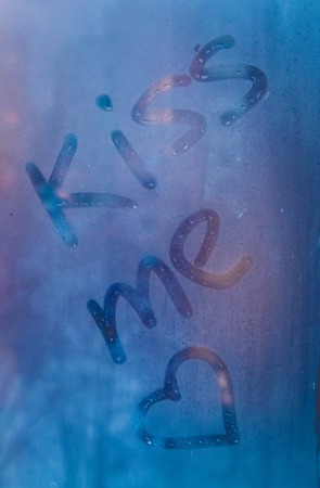 Writing kisses for you on steamy window. Valentine's day backgroundの写真素材