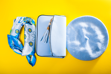 Spring female clothes and accessories. Stylish handbag with blue beret and scarf. Fashionの写真素材