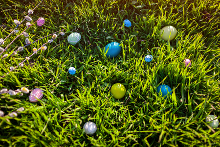 Happy Easter. Easter eggs hidden in spring grass. Holiday decoration