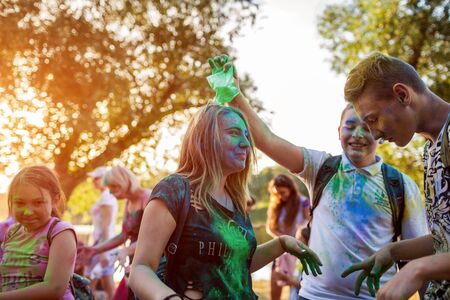 Myrhorod, Ukraine - June 16, 2019: Group of a young people throwing paints on indian Holi festival of colorsのeditorial素材
