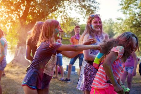 Myrhorod, Ukraine - June 16, 2019: Group of a young people throwing paints on indian Holi festival of colorsのeditorial素材