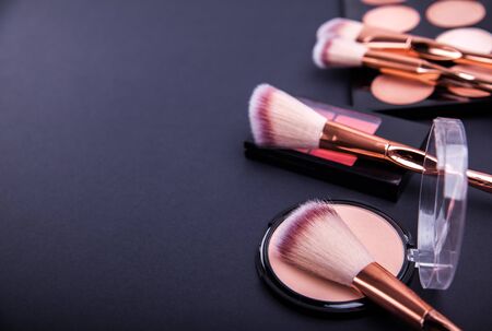 Set of decorative cosmetics for contouring and beautiful make-up looks on black backgroundの写真素材