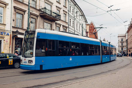 Krakow, Poland - March 8, 2020: Blue tram bombardier in old historic city center.のeditorial素材