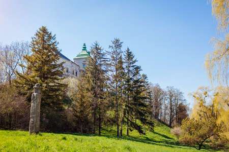 View of Olesko Castle from spring garden. Ancient architecture, landmarks, places of interest in Western Ukraine. Traveling in Lviv regionの写真素材