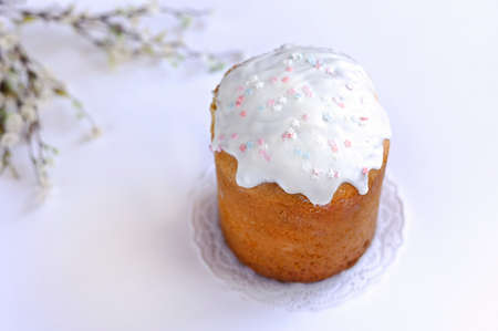 Easter cake, kulich with glaze on white wooden background.の写真素材