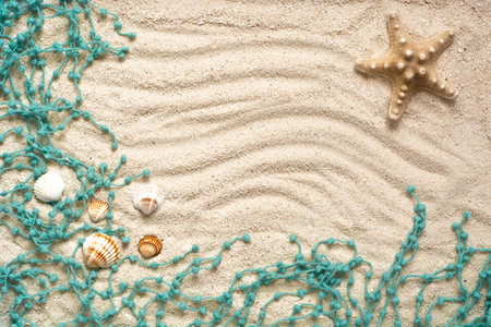 Summer banner with seashells, starfish and details on sandy background. Summer flatlay, top view. Creative concept. Copy space. Place to the text.の写真素材