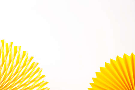 Abstract background with yellow paper fans. Festive celebration backdrop. Mockup for product demonstration. Copy space. Empty place to the text.の写真素材
