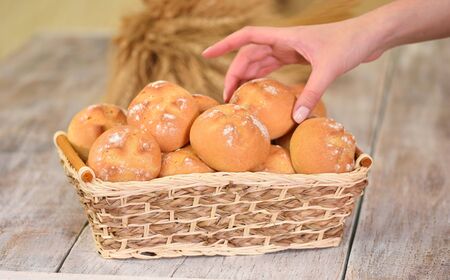Fresh bread rolls in basket at traditional French bakery.の写真素材