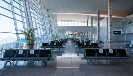 Hurghada / Egypt - 10.12.2020 : Empty Departure Lounge At The Airport terminal. Quarantine sign on benches.のeditorial素材