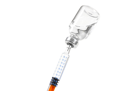 Syringe in a bottle of medicineの写真素材