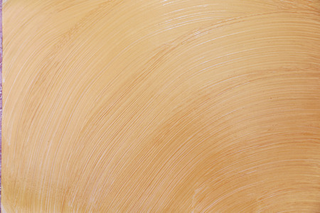 Golden shining texture on blank white sheet. Made by brush. You can use it as texture for the signatureの写真素材