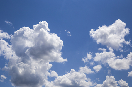 White shaped clouds are on the blue sky on daylightの写真素材