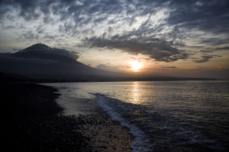 Sunset on the beach closed to Volcanoの写真素材
