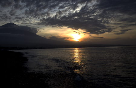 Sunset on the beach closed to Volcanoの写真素材