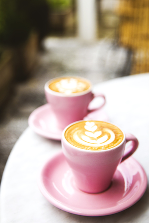 Cup of hot latte coffee on marble table backgroundの写真素材