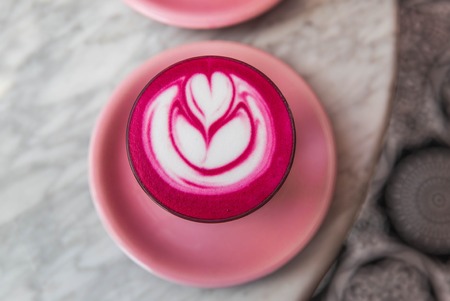 Colorful pink super latte on marble backgroundの写真素材