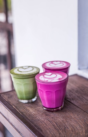 Colorful Beetroot, matcha lattes are on the wooden backgroundの写真素材