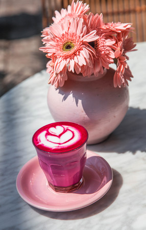 Colorful pink super latte on marble backgroundの写真素材