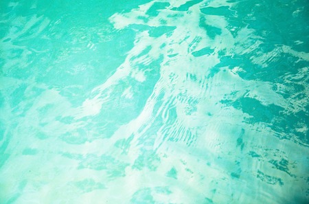 Background of rippled water in swimming poolの写真素材