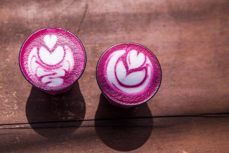 Two Beetroot super latte on marble background. Trandy healthy drinkの写真素材